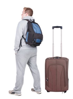 arkadan görünüşü ile bavul seyahat genç adam