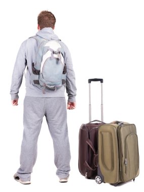 arkadan görünüşü ile bavul seyahat genç adam.