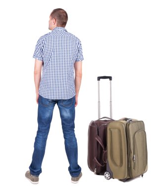 arkadan görünüşü ile bavul seyahat genç adam.