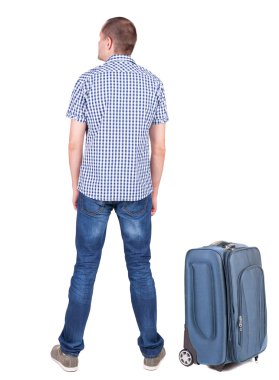 arkadan görünüşü ile bavul seyahat genç adam.