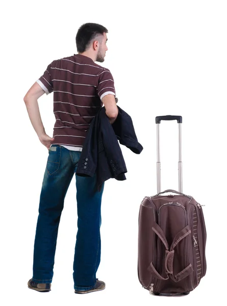 Hombre joven que viaja con maleta Mira hacia adelante. espejo retrovisor. — Foto de Stock