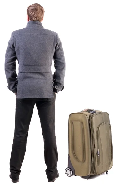 Back view of young man traveling with suitcase. — Stock Photo, Image