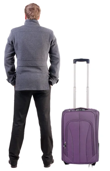 Back view of young man traveling with suitcase. — Stock Photo, Image