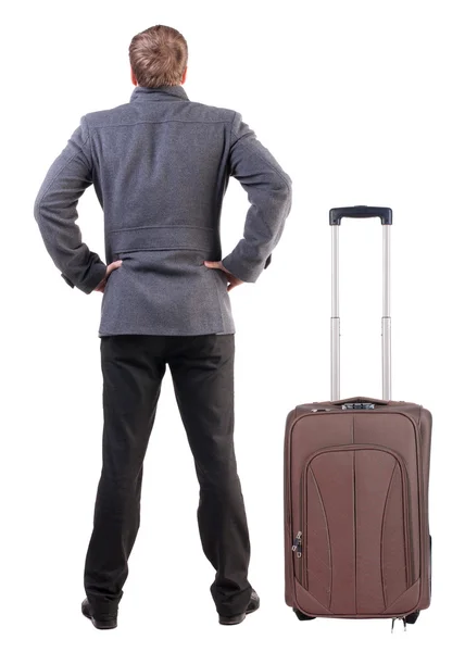 Back view of young man traveling with suitcase. — Stock Photo, Image