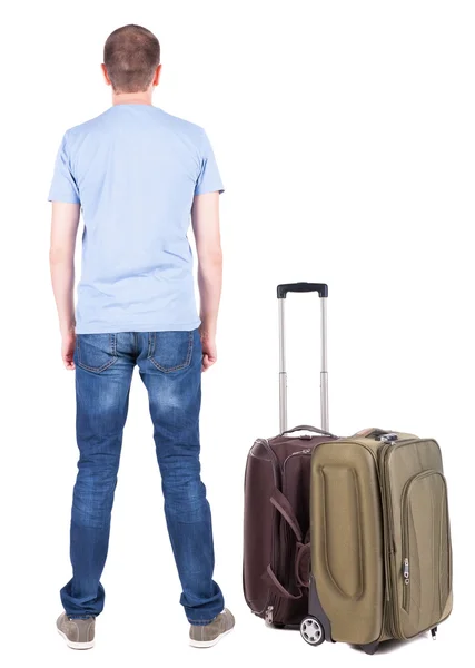 后视图的年轻男子带手提箱旅行. — 图库照片