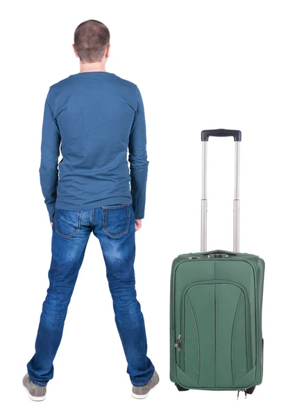 Back view of young man traveling with suitcase. — Stock Photo, Image