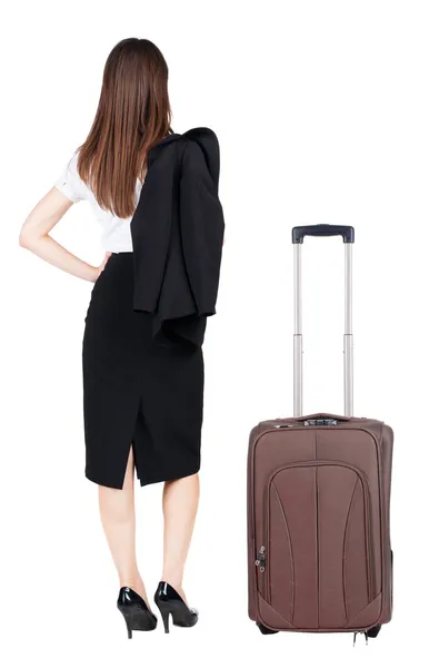Powrót widok przemyślany biznes kobieta podróży z walizką. — Zdjęcie stockowe