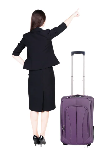 Arkadan görünüşü ile bavul seyahat düşünceli bir iş kadını. — Stok fotoğraf