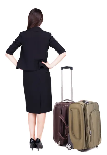 Achteraanzicht van doordachte zakenvrouw reizen met koffer. — Stockfoto