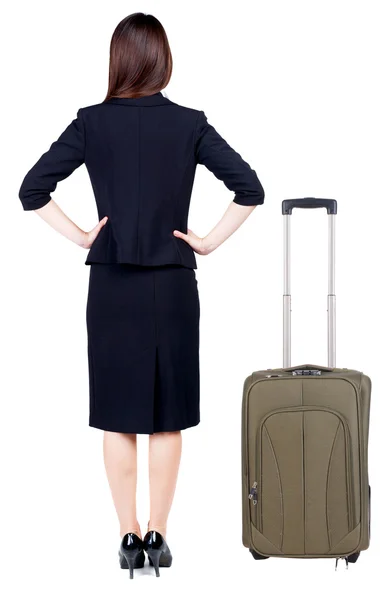 スーツケースと一緒に旅行思慮深いビジネス女性の背面図. — ストック写真