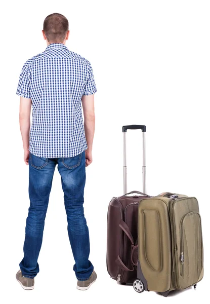 Back view of young man traveling with suitcase. — Stock Photo, Image