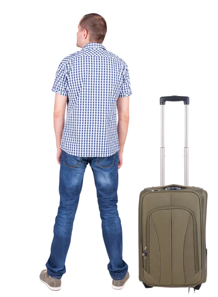 Back view of young man traveling with suitcase. — Stock Photo, Image