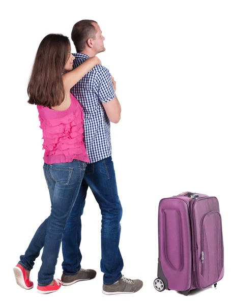 Back view of young couple traveling with suitcase. — Stock Photo, Image