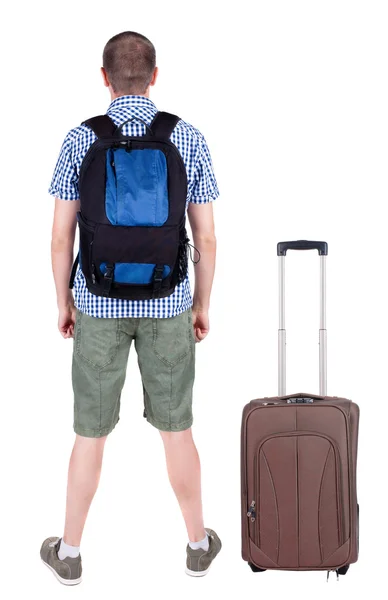 スーツケースと一緒に旅行の若い男の背面図. — ストック写真