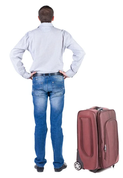 Back view of young man traveling with suitcase. — Stock Photo, Image