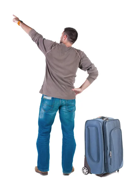 Vista di puntamento giovani uomini in viaggio con valigia posteriore . — Foto Stock