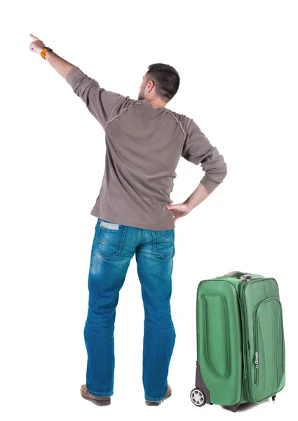 Вид ззаду, що вказує на молодих чоловіків, які подорожують з валізою  . — стокове фото