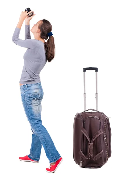 Back view of woman photographing traveling with suitcase. — Stock Photo, Image