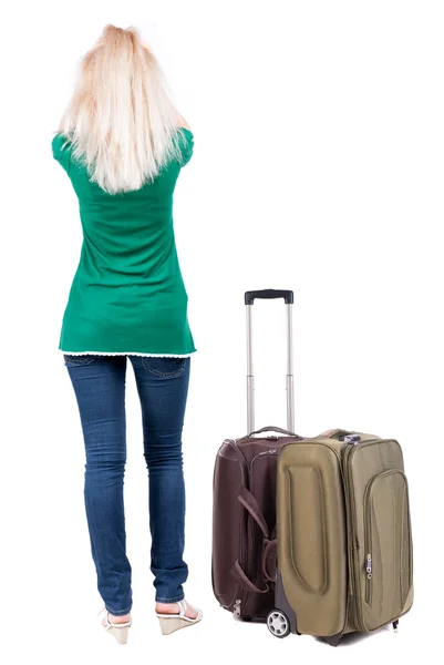 Back view of standing young beautiful blonde woman with suitcase — Stock Photo, Image
