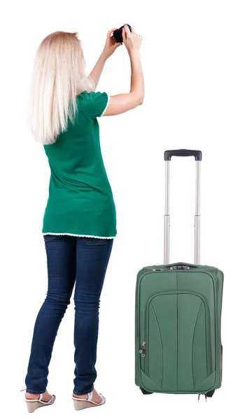 Back view of woman photographing traveling with suitcase. — Stock Photo, Image