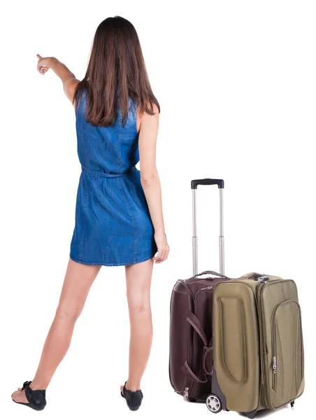 Back view of young brunette woman traveling with suitcase — Stock Photo, Image