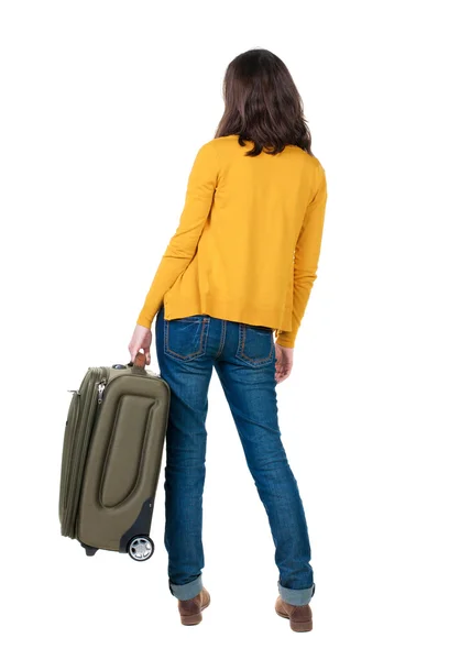 Back view of walking woman with suitcase. — Stock Photo, Image