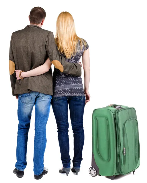 后视图和手提箱旅行对年轻的夫妇. — 图库照片