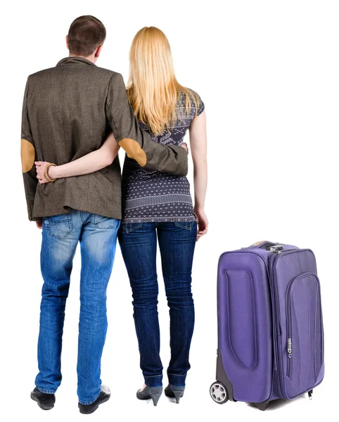 Back view of young couple traveling with suitcase. — Stock Photo, Image