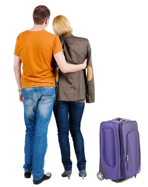 Back view of young couple traveling with suitcase . — Stock Photo, Image