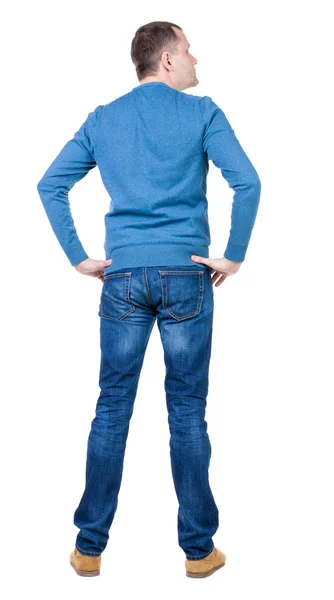 Back view of handsome man in blue pullover looking up. — Stock Photo, Image