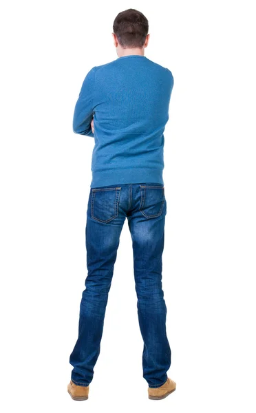 Rückansicht des gut aussehender Mann in blauer Pullover nachschlagen. — Stockfoto