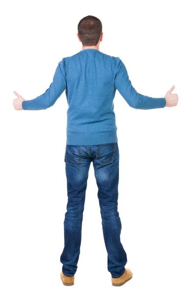 Back view of man in sweater shows thumbs up. — Stock Photo, Image