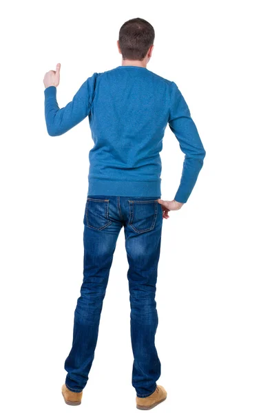 Rückansicht der Mann im blauen Pullover auftaucht Daumen. — Stockfoto