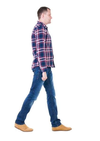 Back view of going handsome man in checkered shirt. — Stock Photo, Image