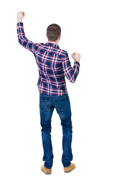 Back view of man in checkered shirt shows thumbs up. — Stock Photo, Image