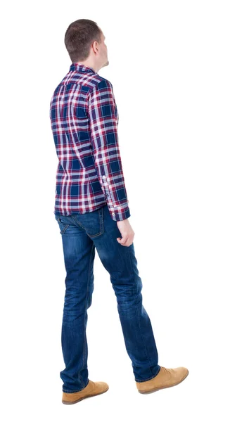 Back view of going handsome man in checkered shirt. — Stock Photo, Image