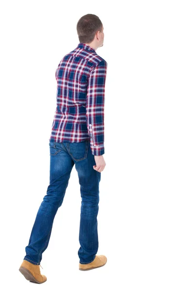 Back view of going handsome man in checkered shirt. — Stock Photo, Image