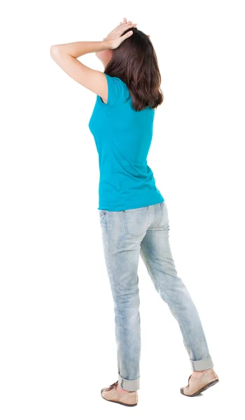 Вид ззаду шокованої жінки в блакитних джинсах — стокове фото