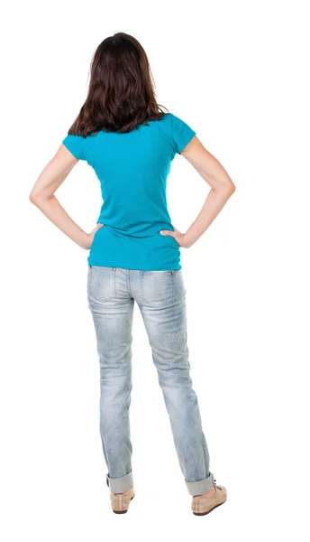 Vista della giovane donna in piedi brunetta bellissima in jeans posteriore. — Foto Stock