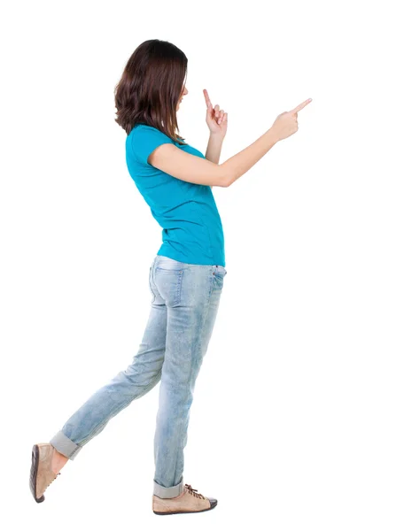 Vista posteriore della donna che punta . — Foto Stock