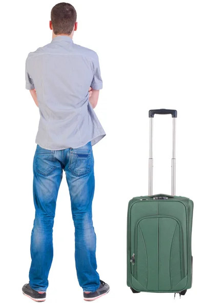 Οπίσθια όψη νεαρού άνδρα που ταξιδεύουν με βαλίτσα. — Φωτογραφία Αρχείου