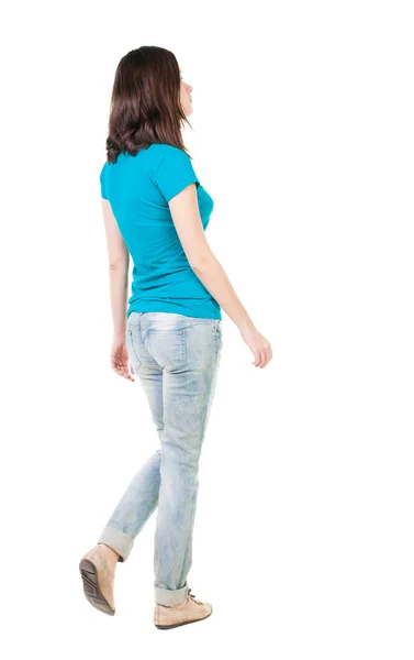 Back view of walking woman in jeans . — Stock Photo, Image
