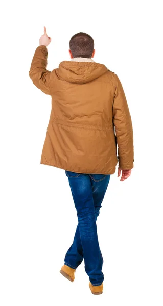 Back view of pointing young men in parka. Young guy gesture. — Stock Photo, Image