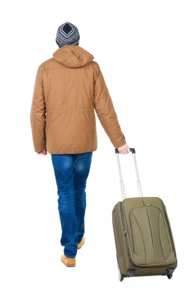 Back view of walking man in park with suitcase — Stock Photo, Image