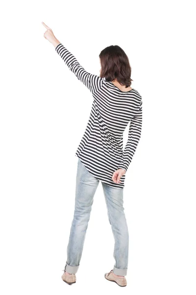 Bakifrån av pekar kvinna i klänning. — Stockfoto