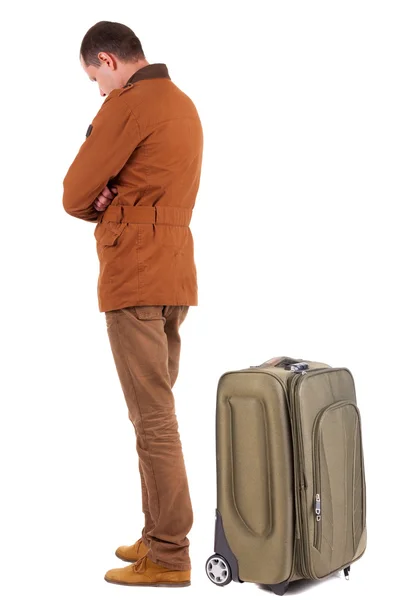 Back view of young man traveling with suitcase. — Stock Photo, Image