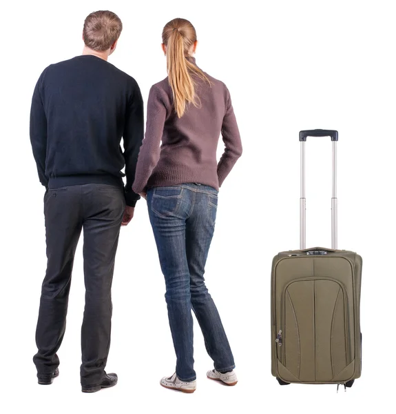 Back view of young couple traveling with suitcase. — Stock Photo, Image