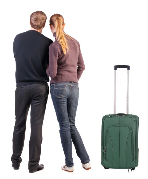 Back view of young couple traveling with suitcase. — Stock Photo, Image