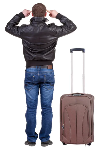 Vista posterior de joven viaja con maleta. —  Fotos de Stock
