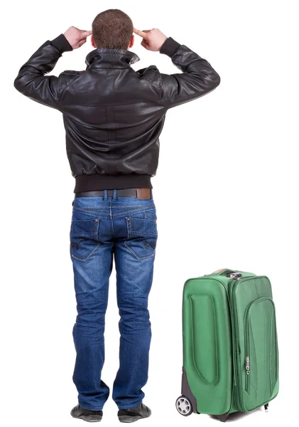 Rückansicht des jungen Mannes Reisen mit Koffer. — Stockfoto